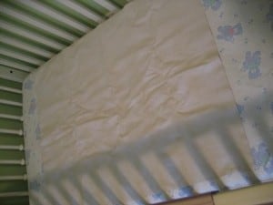 First the waterproof pad on top of the mattress...
